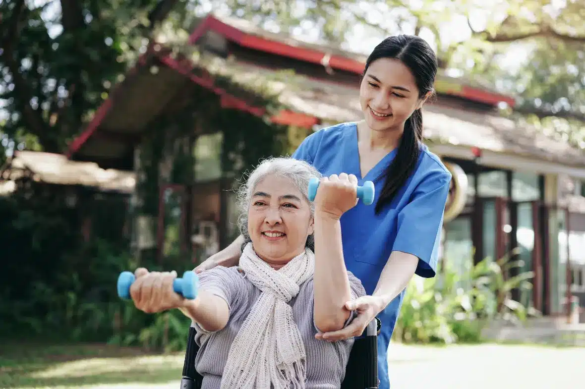 A caregiver and a senior sharing a moment at home